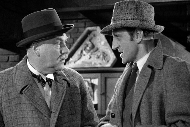 Sherlock Holmes (Basil Rathbone, l.) und Dr. Watson (Nigel Bruce, r.)
